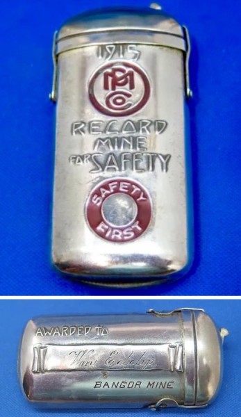 The 1915 Match Safe, Front And Back.<br />The Seller's Description:<br />Bangor Mine Safety Award match safe, MP Co. nickel plated, dated 1915.<br />This is a rare 1915 safety award presentation match safe awarded to Wm. Eddy by the Bangor Mine, Bangor, PA. The front is embossed "1915, MP Co., Record Mine for Safety, Safety First" with red enamel highlights. The reverse is marked "Awarded to: Wm Eddy, Bangor Mine." It has a unique mechanical locking lid that pivots on two side slotted bars and a locking device for the lid on top. One side bar is stamped "Pat. Oct. 1912" references patent number 1,040,931 issued on Oct. 8, 1912. The match safe is nickel plated brass and measures approximately 3 1/8 x 1 1/2 inches with a striker to the bottom. Excellent condition."<br />Made By The Same Company That Made The Pocket Knife?