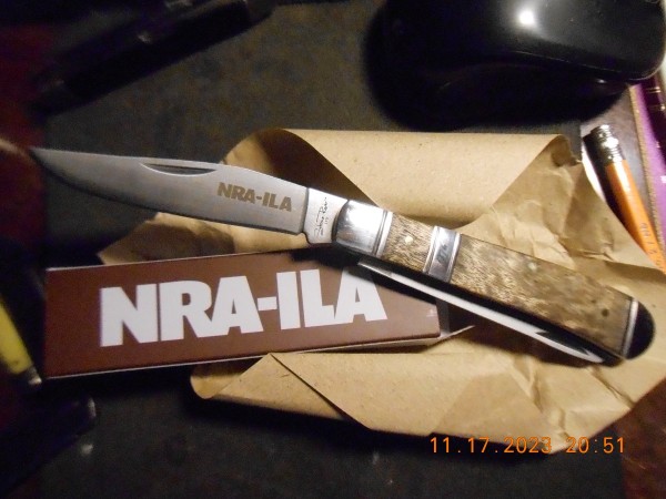 An NRA knife result of a donation to NRA-ILA. It was made in China, a Stone River Trapper.  Pretty well made, has 1776 on the band across the handle.