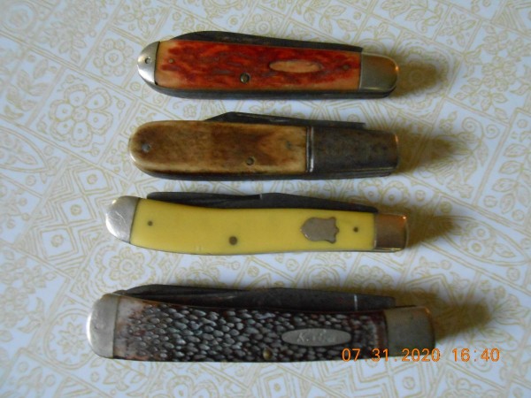 2nd knife down: Long bolster, no cap/bolster on opposite end, Barlow pattern.