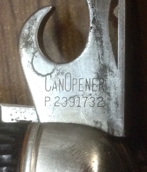 The Can Opener Tool Front Stamp.