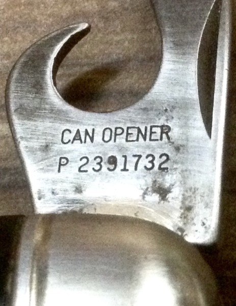 The Can Opener Tool Front Stamp.