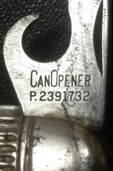 The Can Opener Tool Front Stamp.