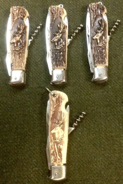 The Top Three Pocket Knives Have A Lanyard Loop Or Ring.<br />The Bottom Pocket Knife Has A Bail.
