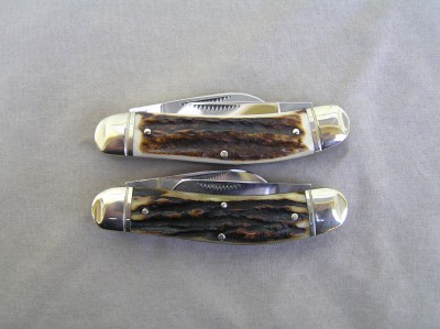 Ohio, look at the pulls and etch, knife in question is at the top. Pulls on real first generation have much finer serrations.