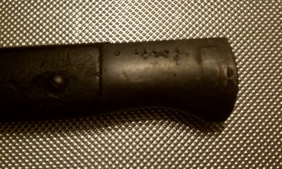 Numbers read: D 114 45<br /><br />the millitary looking marks are to the right of what could be a serial number