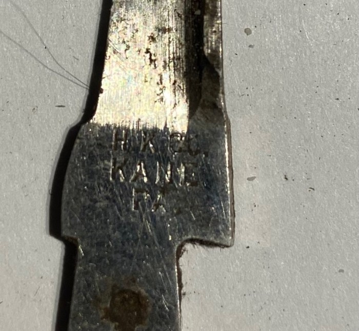 Stamp on smaller blade