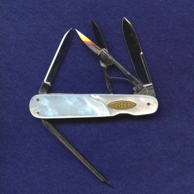 A 2 3/4" four blade lobster with gold toned<br />PocketEze shield.<br />All long pulls.<br />Pattern Number 742205.