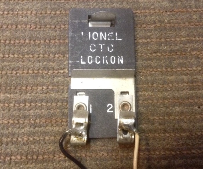 THE LIONEL TRANSFORMER TO TRACK CONNECTOR.