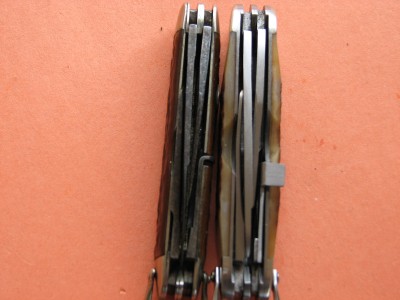 The repro model is considerably wider than the original model.  That is shown in this picture looking at the two knives from above.