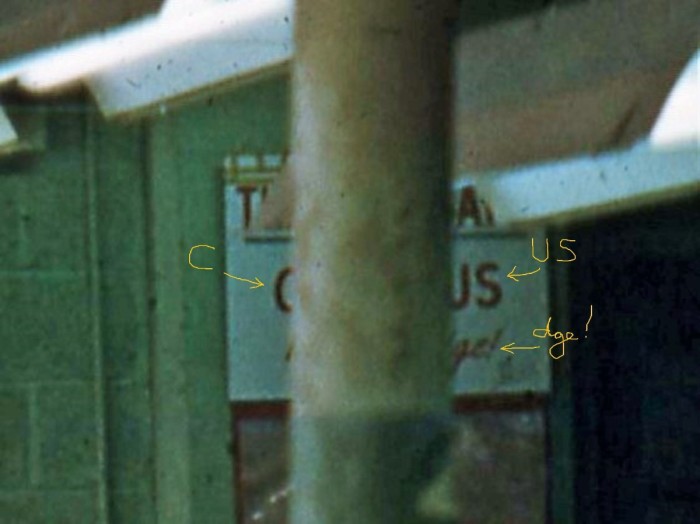 Crop of sign with supposed letters
