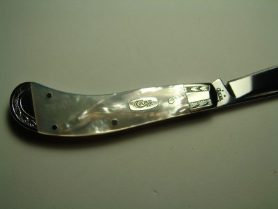 Case Pearl Saddlehorn Custom Jewelry engraved bolsters with running leaf pattern.