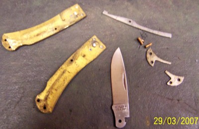 Here are the pieces after I cut it apart. The springs were broken so i had to replace them.